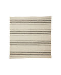 A striped patterned beige and gray bed cover laid out flat.