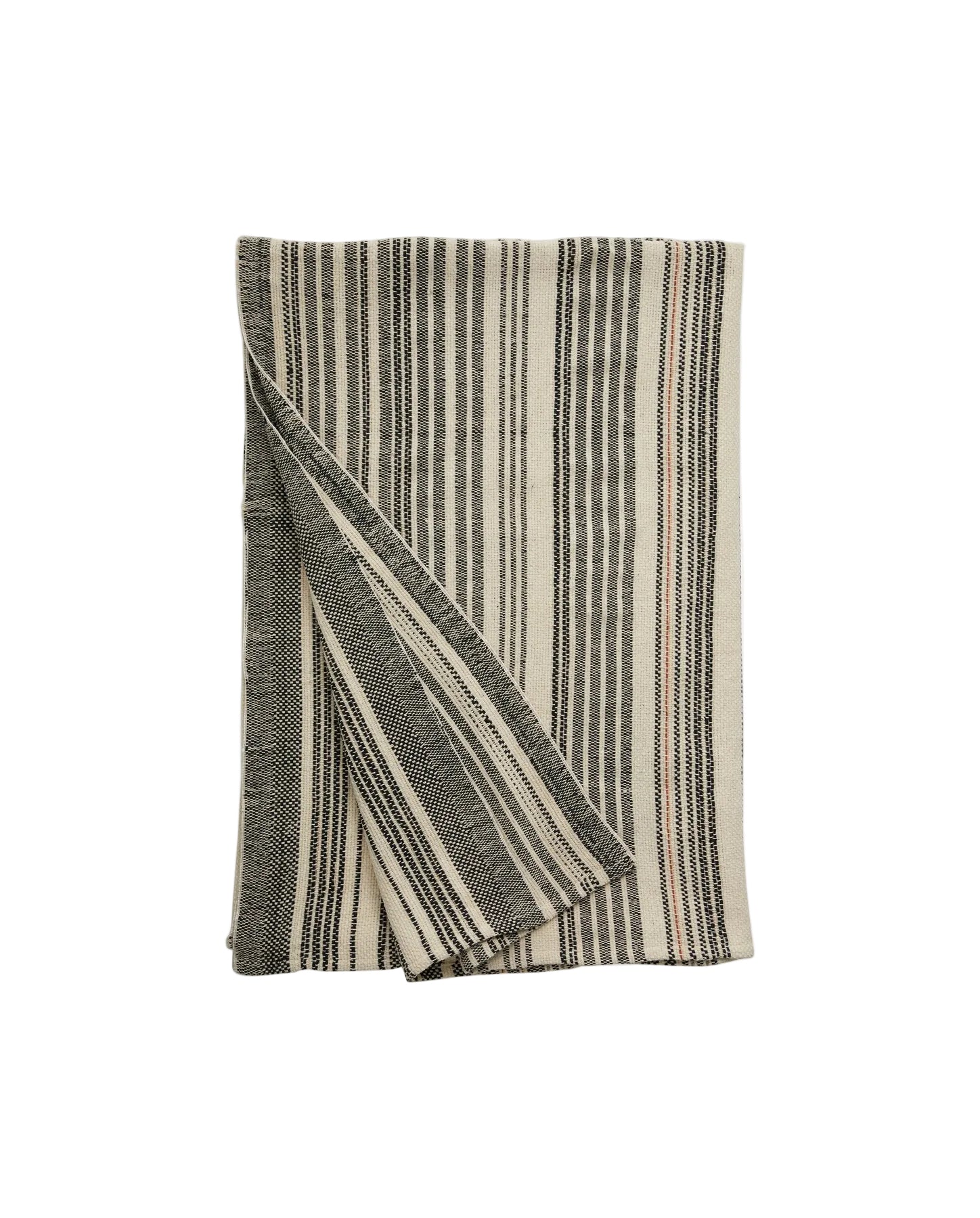A folded striped bed cover in varying shades of gray and beige, with a decorative pattern.