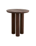 A dark brown round HELIN cafe table with three cylindrical legs made of mango wood.