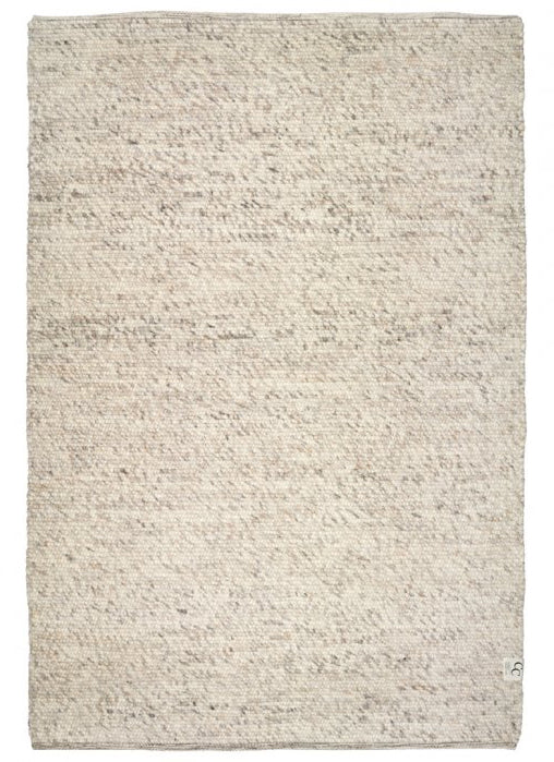 Textured beige rug on a white background