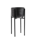 A medium-sized black oxidized aluminum planter on a stand made of iron.