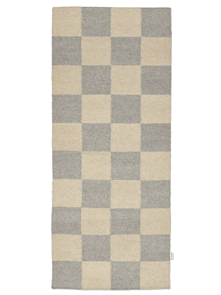 Checkered rug with beige and gray squares on a white background