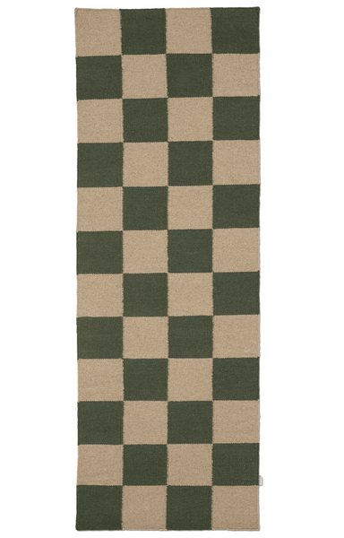 Checkered rug with green and beige squares on a white background
