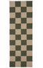Checkered rug with green and beige squares on a white background