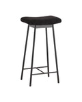A black bar stool with a padded seat made of teddy fabric and iron legs, including footrest bars.