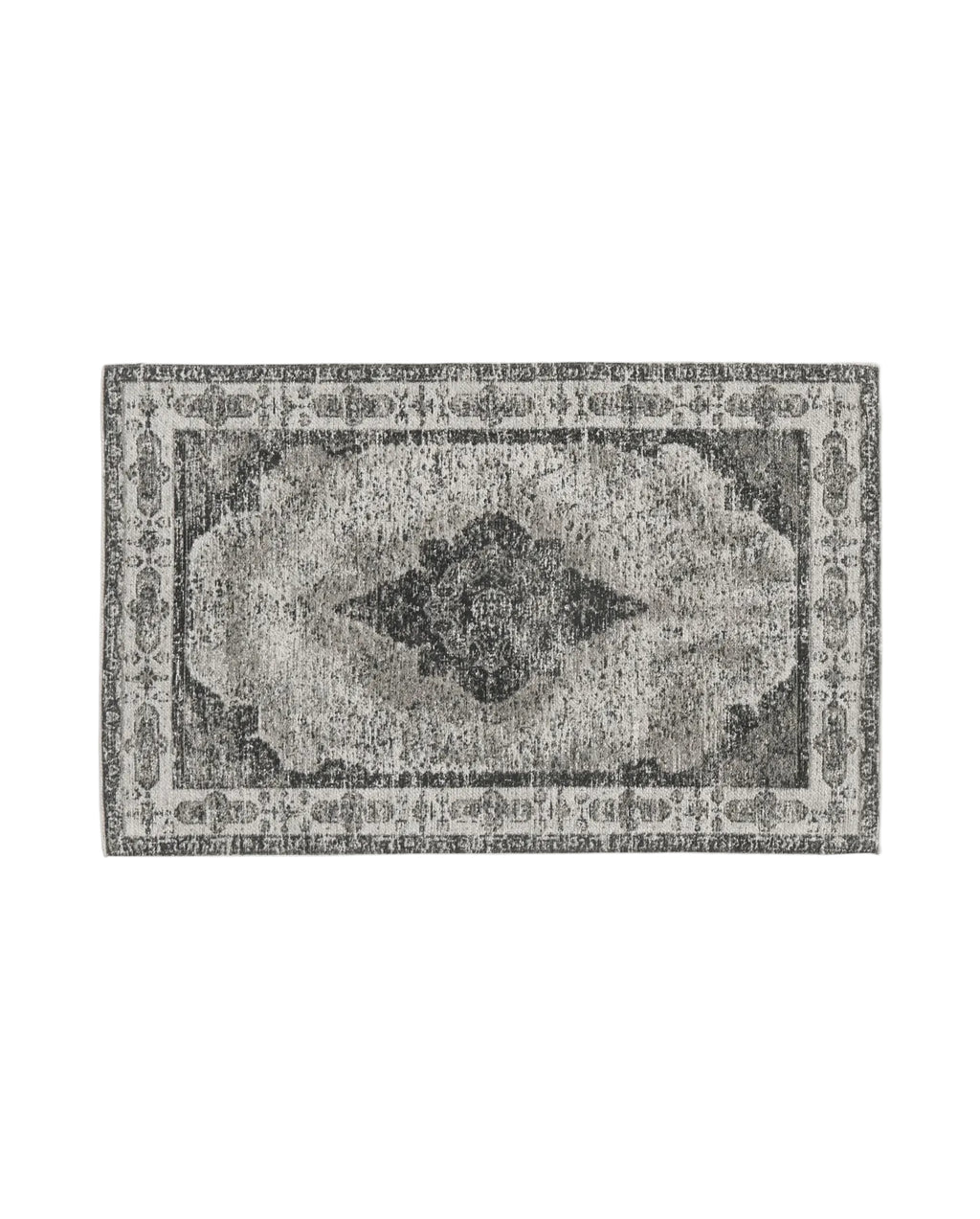 A rectangular, dusty grey woven rug with a classic, antique pattern and a hand knotted appearance.