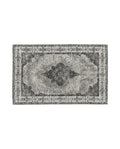 A rectangular, dusty grey woven rug with a classic, antique pattern and a hand knotted appearance.
