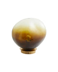 A brown EDFU ceiling lamp with an organic shape made of glass.