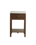 A wooden nightstand with a marble top and a brass metal knot on the drawer.