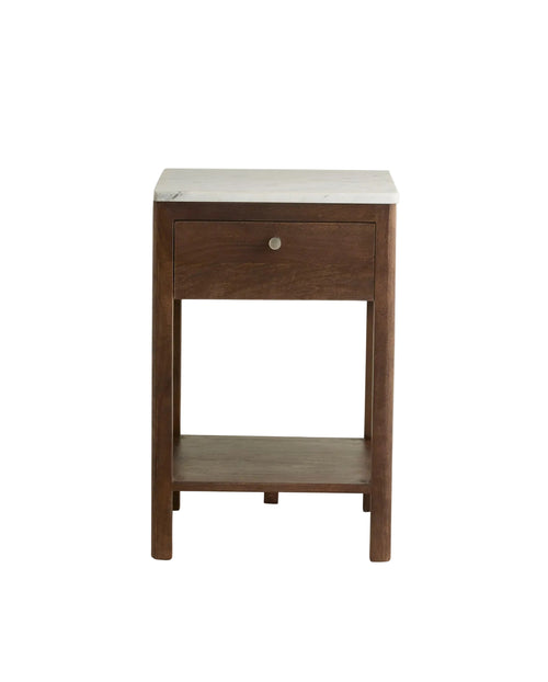 A wooden nightstand with a marble top and a brass metal knot on the drawer.