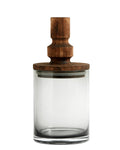 A clear glass storage container with a brown wooden lid, featuring a solid glass body and a cylindrical wooden lid with a knob on top.